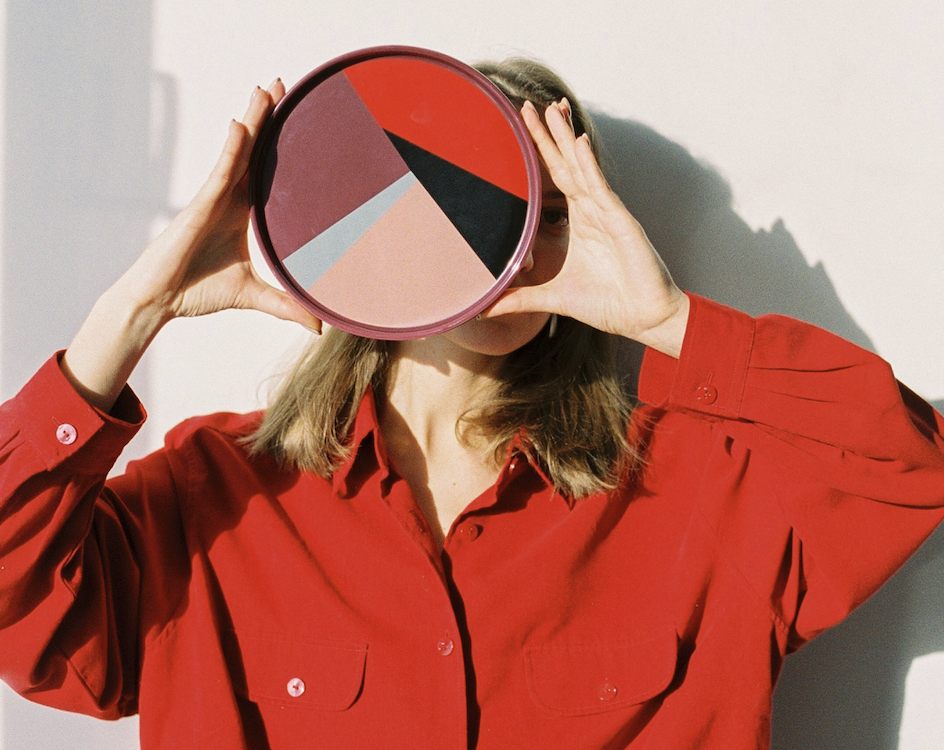 Image of a Woman Holding a Colorful Wheel